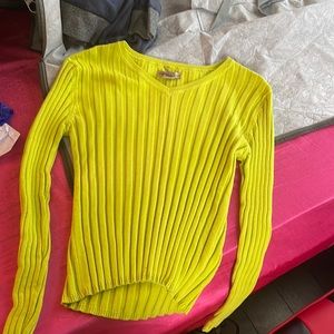 a short v neck like green sweater